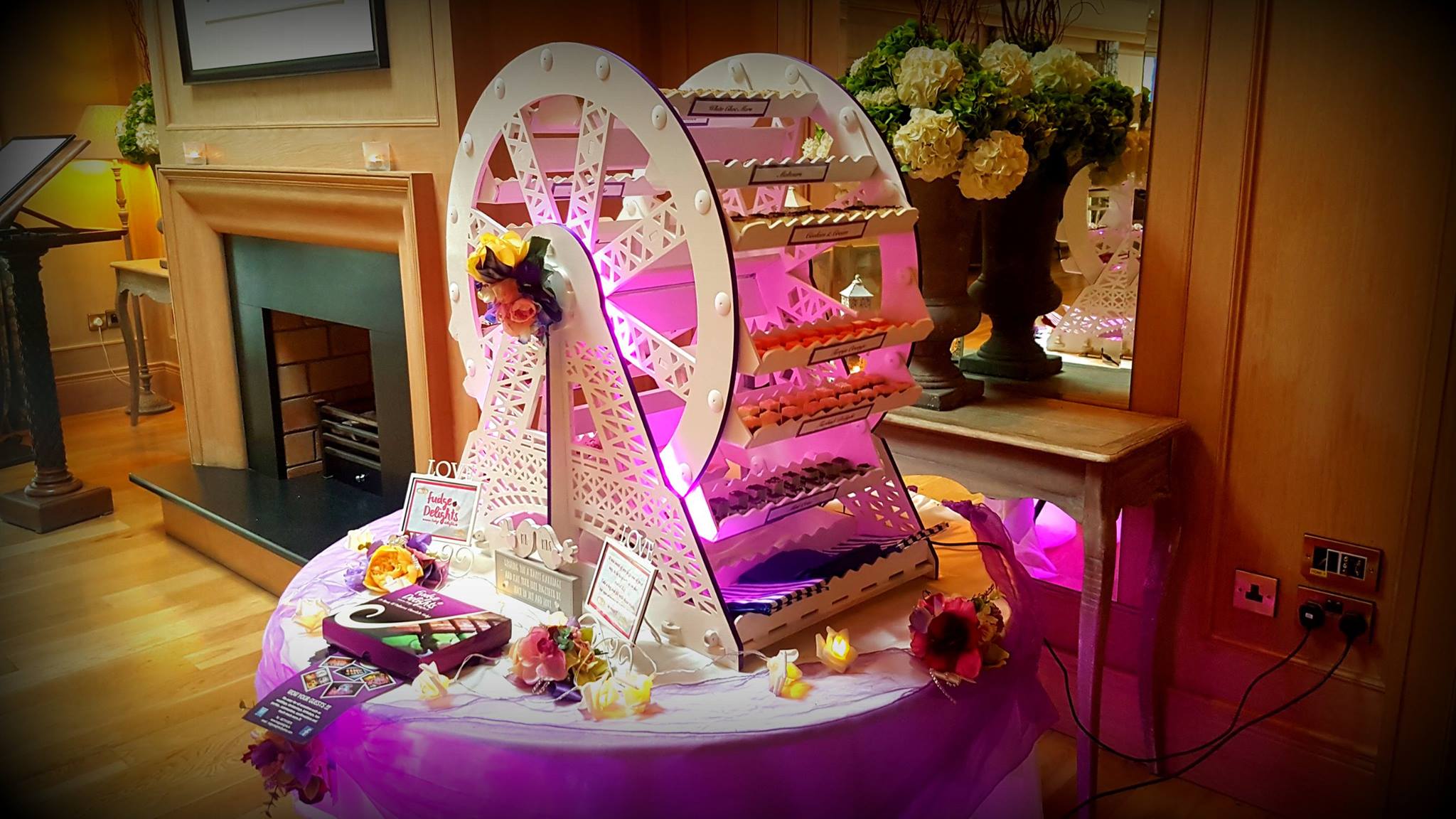 Fudge Delights Ferris wheel display filled with colourful sweet treats